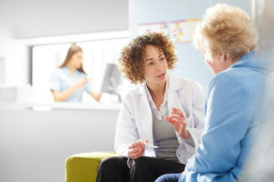 Female doctor with a female patient