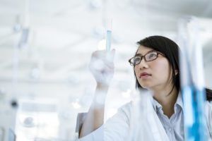 Female doctor observing sample