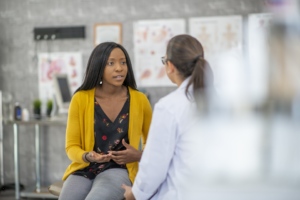 Doctor talking to female patient