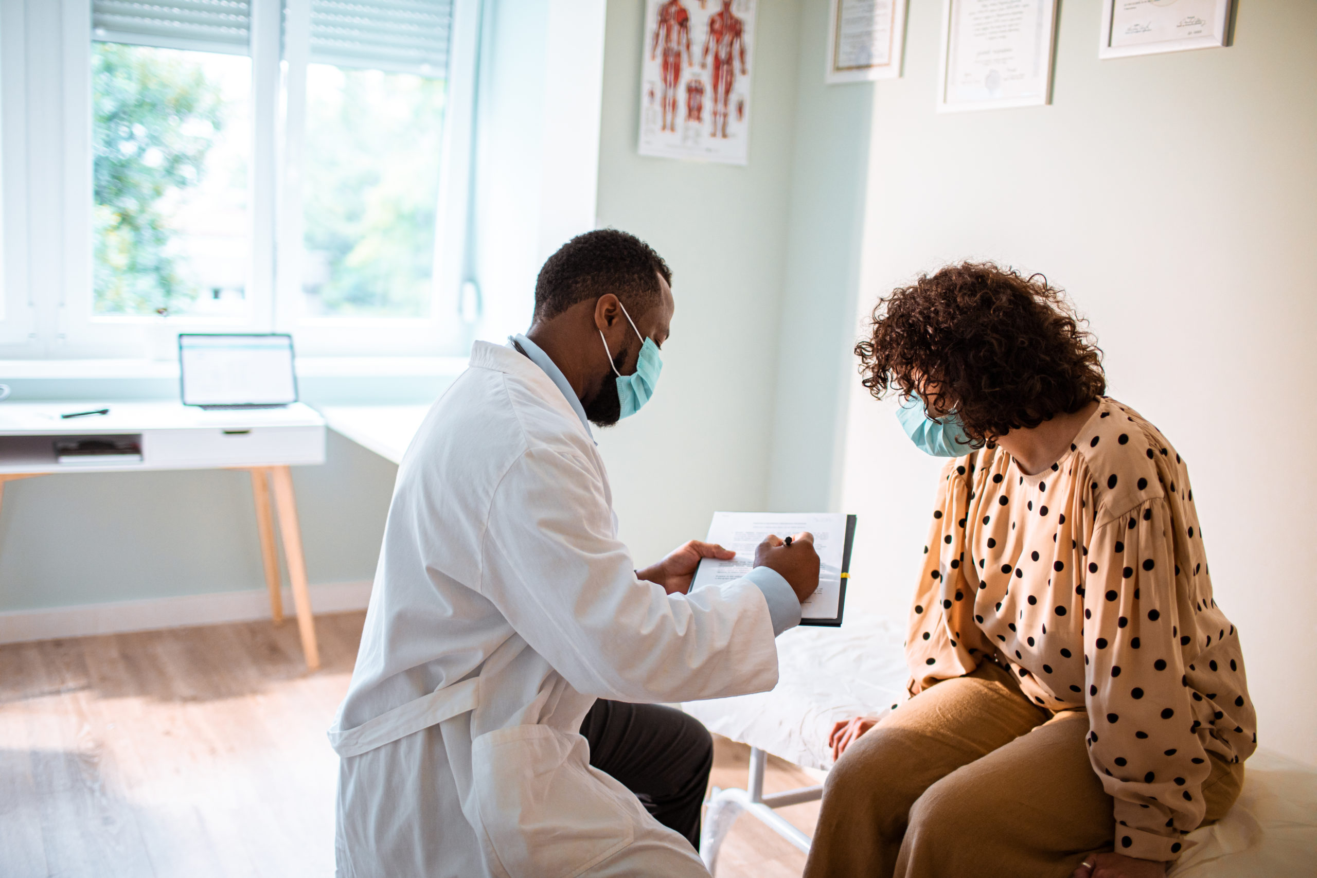 Male doctor with female patient