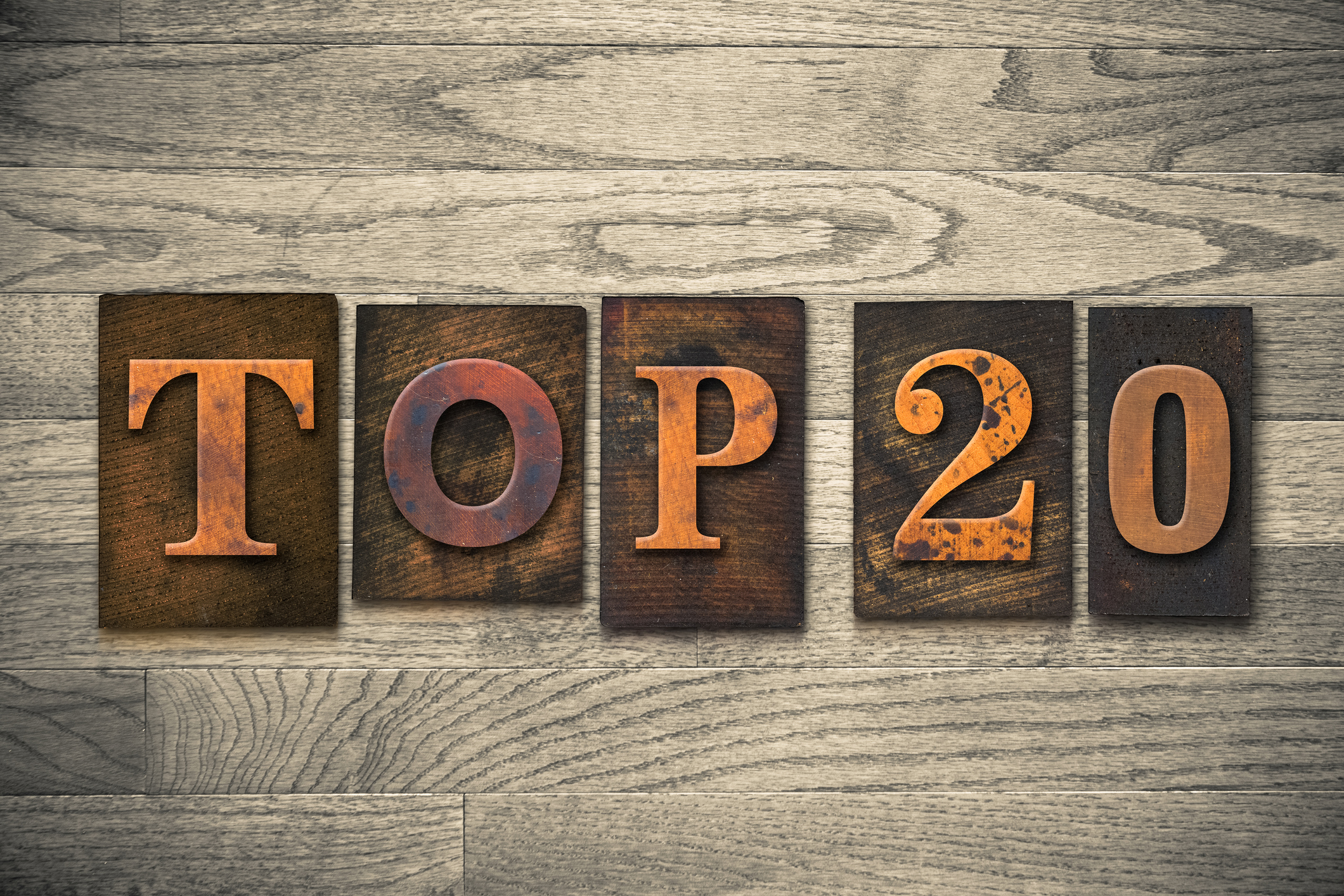 The words "TOP 20" written in wooden letterpress type.