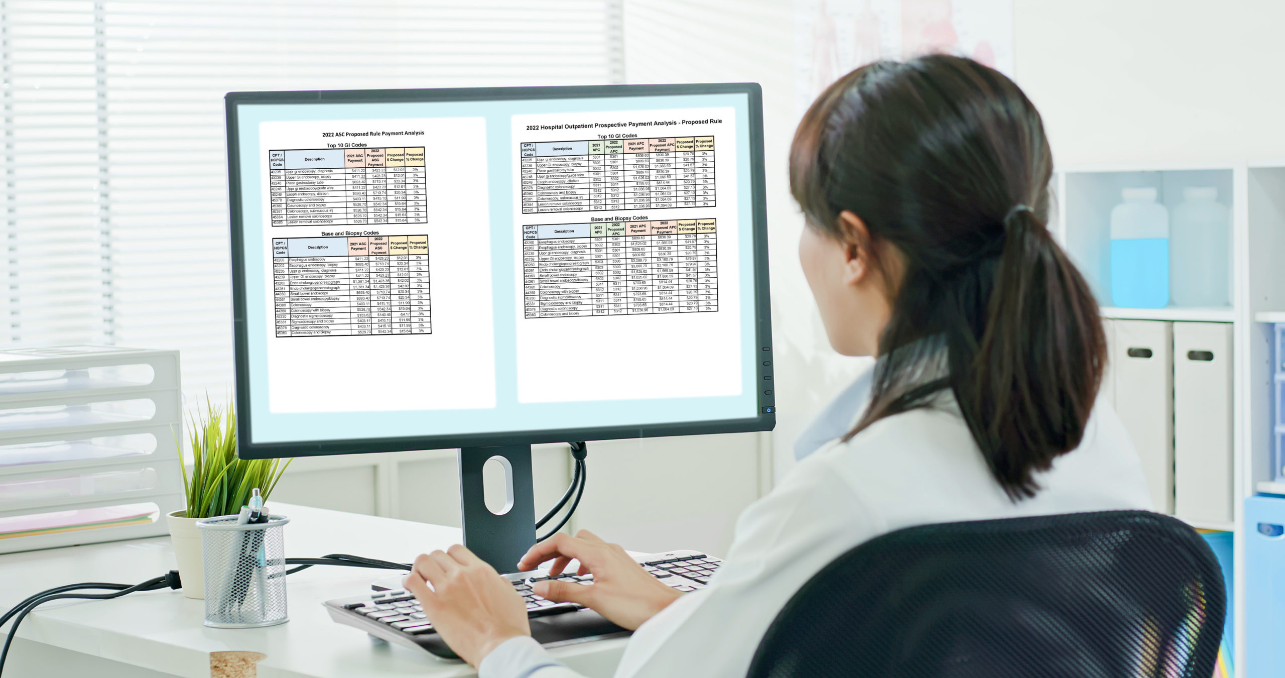 woman doctor work and use a computer with green screen monitor in the clinic