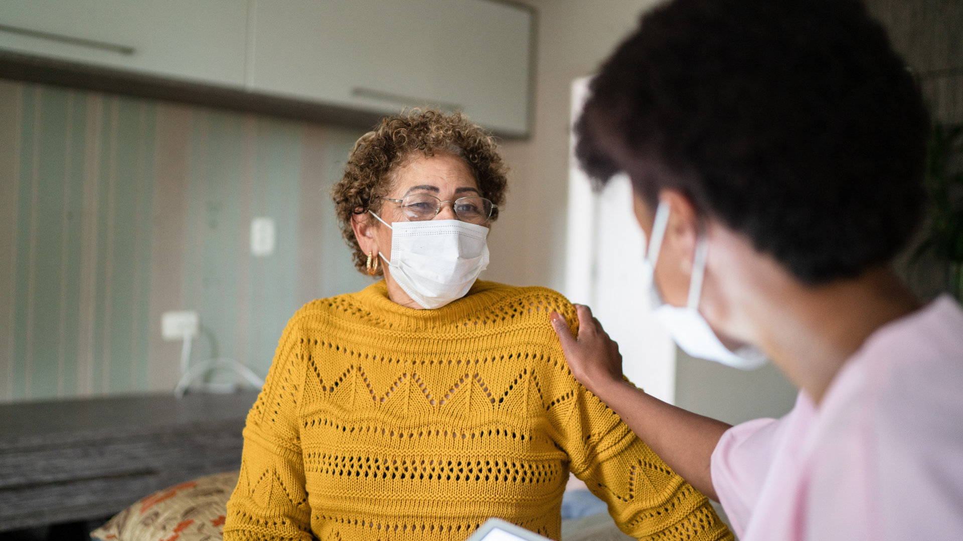 Older woman at doctor's office in mask