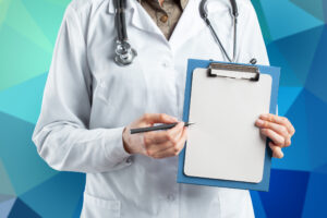 Hands of medical doctor on paperwork