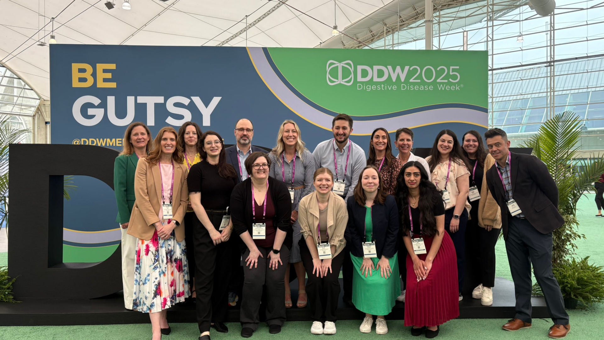Attendees pose with the DDW letters.