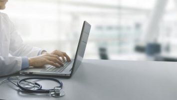 doctor working on laptop computer in modern clinics office. copy space doctor working on laptop computer in modern clinics office. copy space