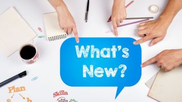 What’s New. The meeting at the white office table. What's New. The meeting at the white office table