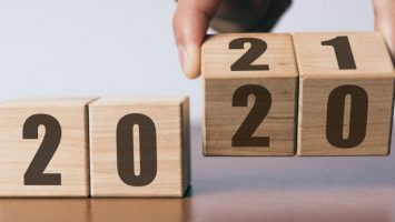 New year 2020 change to 2021 concept, hand change wooden cubes New year 2020 change to 2021 concept, hand change wooden cubes
