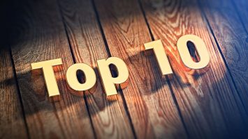 The word "Top 10" is lined with gold letters on wooden planks. 3D illustration image