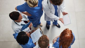 Monitoring the health of their patients High angle shot of a group of medical practitioners working together in a hospital
