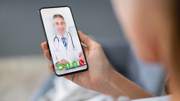 Person Videochatting With Doctor Doctor on Telephone