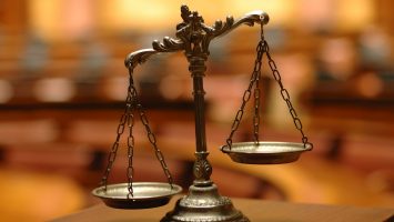 Symbol of law and justice , decorative Scales of Justice Symbol of law and justice in the empty courtroom, law and justice concept.