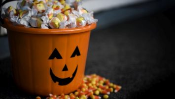 Bucket of Halloween Candy with Jack o Lantern, Copy Space Bucket of Halloween Candy with Jack o Lantern, Copy Space