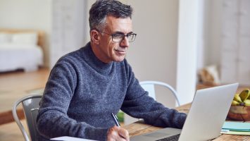 He works hard, from home or the office Shot of a handsome and mature businessman working from home
