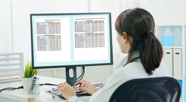 woman doctor work and use a computer with green screen monitor in the clinic