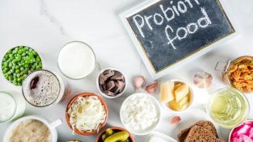 Super Healthy Probiotic Fermented Food Sources Super Healthy Probiotic Fermented Food Sources, drinks, ingredients, on white marble background copy space top view