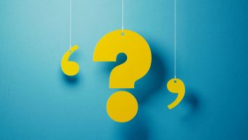 Yellow Question Mark With String Over Blue Background Yellow Question Mark With String Over Blue Background