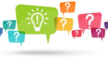 speech bubbles with colored question marks and with green light bulb symbolizing idea or solution