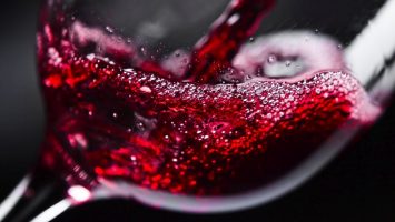 Red wine Red wine in wineglass on black background