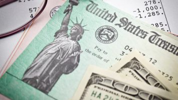 Tax Refund Tax refund with glasses and money on tax return.