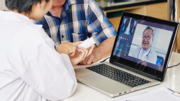 Nurse recommending tablets to patient Nurse recommending tablets to patient