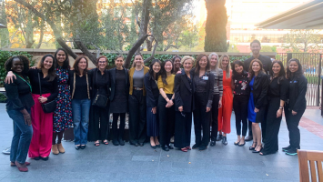 A group photo on an outdoor patio of the women who attended the Women in GI workshop at the University of California, Los Angeles.