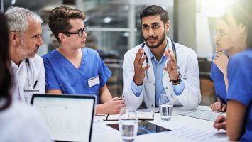 Shared medical knowledge benefits his coworkers and patients Shot of a team of doctors having a meeting