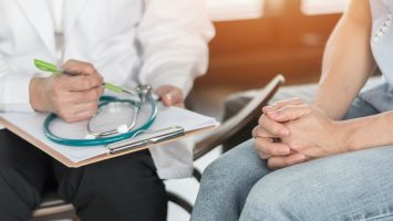 Doctor or psychiatrist consulting and diagnostic examining stressful woman patient on obstetric – gynecological female illness, or mental health in medical clinic or hospital healthcare service center Doctor or psychiatrist consulting and diagnostic examining stressful woman patient on obstetric - gynecological female illness, or mental health in medical clinic or hospital healthcare service center